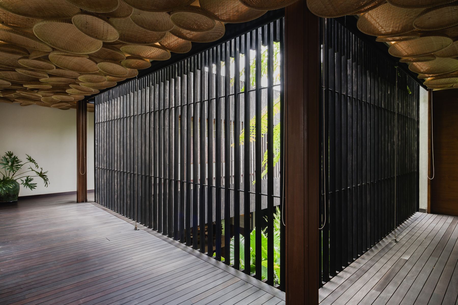 Covered deck behind slatted screen
