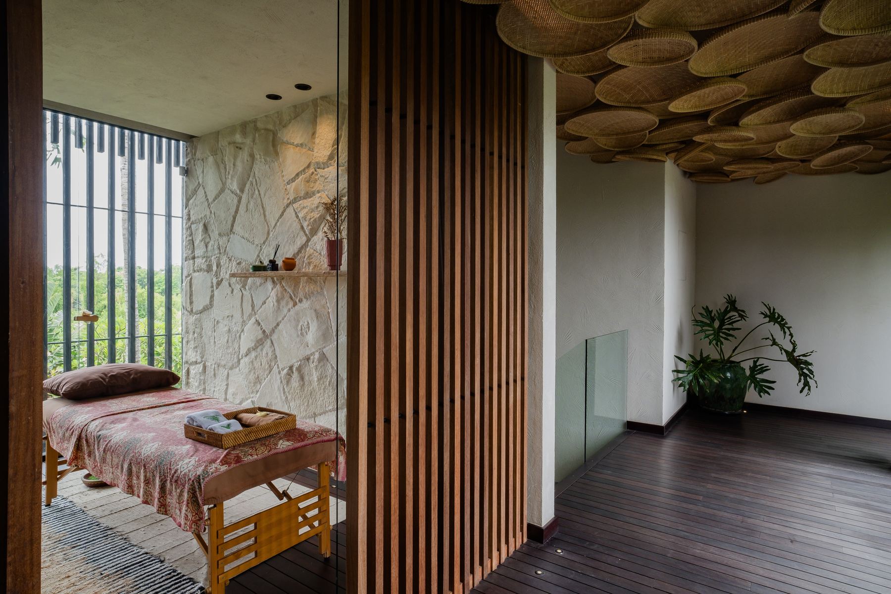 Massage table beside stone wall